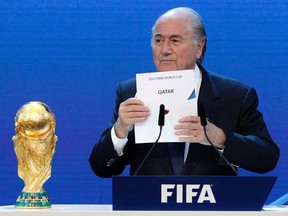 FIFA President Sepp Blatter announces Qatar as the host nation for the FIFA World Cup 2022, in Zurich in this December 2, 2010 file photo. (REUTERS/Christian Hartmann/Files)