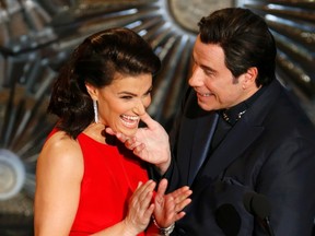 Idina Menzel and John Travolta present the Oscar for best original song at the 87th Academy Awards in Hollywood, California February 22, 2015. REUTERS/Mike Blake