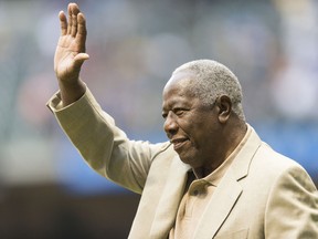 Hall of famer Hank Aaron waves to the crowd before the start of the Washington Nationals game at Miller Park on August 2, 2013. (Tom Lynn/Getty Images/AFP)