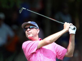 Davis Love III tees off with an iron during practice for the 2014 PGA Championship at Valhalla Country Club. (Brian Spurlock/USA TODAY Sports)