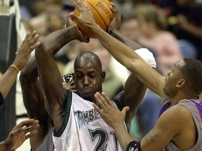 Kevin Garnett (21), seen here playing with the Timberwolves in 2002, returned to Minnesota following a trade last week. (Eric Miller/Reuters/Files)