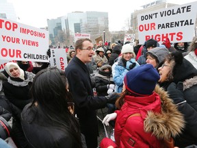PC MPP Monte McNaughton talks to demonstrators on Tuesday  at Queen's Park. Protesters were opposed to the government's recently announced changes to the sex-ed curriculum. (MICHAEL PEAKE, Toronto Sun)