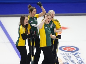 Northern Ontario skip Tracey Horgan (L-R) second Jenna Enge, third Jennifer Horgan and lead Amanda Gates dance to a Katy Perry song before the start of their game against Quebec during the Scotties Tournament of Hearts in Moose Jaw, Saskatchewan, February 15, 2015.