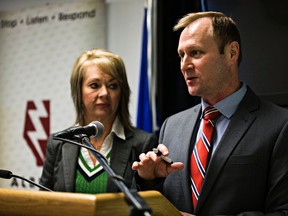 Municipal Affairs minister Diana McQueen, left, and Alberta Emergency Management Agency acting managing director Shane Schreiber, right, speak during a press conference about the government's plan to improve the way Alberta responds to disasters at the Provincial Operations Centre in Edmonton, Alta., on Tuesday, Feb. 24, 2015. Codie McLachlan/Edmonton Sun/QMI Agency