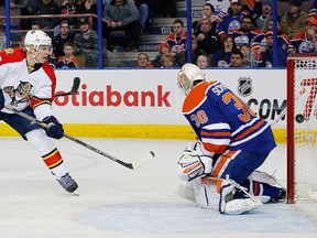 Florida Panthers forward Sean Bergenheim (left) scores on Edmonton Oilers goaltender Ben Scrivens at Rexall Place. (Perry Nelson/USA TODAY Sports)