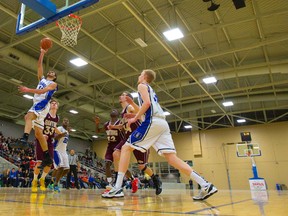 Beal?s Hadi Akle drives for a layup during the TVRA Central Conference AAAA senior boys basketball final against Banting at the Western Fair Agriplex on Tuesday night. Beal won 53-20. (Mike Hensen, The London Free Press)