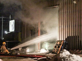 Kingston Fire and Rescue responded to a building fire inside J. Harrison Excavating and Pipeline Ltd off Terry Fox Drive on Tuesday. No one was in the building at the time of the blaze, which included black smoke and a strong burnt rubber smell.  (Julia McKay/The Whig-Standard)