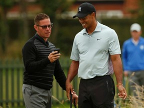 Tiger Woods (right) and his former swing coach Sean Foley (left). (Reuters file)