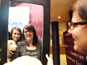 Gino Donato/The Sudbury Star
Second year Cambrian College public relations students Kaleigh McIntyre and Candice Morel look at a mirror that will be available at a silent auction at the Country Fair the students are helping organize. The event takes place on Feb. 28 from 11 a.m. to 6 p.m. at the Cambrian College Student Centre and is in support of The Cambrian Foundation and Kicx for Kids.