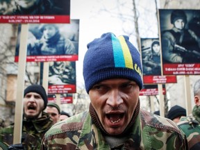 Activists of the Right Sector political party attend an anti-government march in Kiev February 25, 2015.  REUTERS/Valentyn Ogirenko