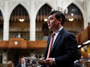 Conservative Member of Parliament Michael Chong tables an amended version of his private member’s bill aimed at giving MPs more power, in the House of Commons on Parliament Hill in Ottawa on April 7, 2014. (REUTERS/Chris Wattie)