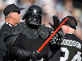 An Oakland Raiders fan dressed as Darth Vader supports his team during the game against the Buffalo Bills at O.co Coliseum on December 21, 2014. (Thearon W. Henderson/Getty Images/AFP)