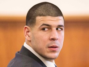 Former New England Patriots player Aaron Hernandez looks towards the media during his murder trial at the Bristol County Superior Court in Fall River, Massachusetts, February 25, 2015.  REUTERS/Aram Boghosian/Pool