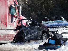 One person is dead following a collision involving several vehicles, including the tractor trailer and SUV shown here, on Highway 401 just east of Highway 37 on Feb. 25, 2015, in Belleville, Ont. - Emily Mountney-Lessard/The Intelligencer