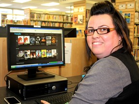 Sarah Hart, manager of marketing, outreach and programs for the Chatham-Kent Public Library, displays the hoopla application, which allows library users to download movies, television shows, music and audiobooks for free. Photo taken in Chatham, Ont. on Wednesday February 25, 2015. Ellwood Shreve/Chatham Daily News/QMI Agency