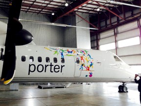 The Porter Airlines Bombardier Q400 aircraft with Game-themed plane decals for this summer's upcoming event on Feb. 25, 2015. (Kevin Connor/Toronto Sun)