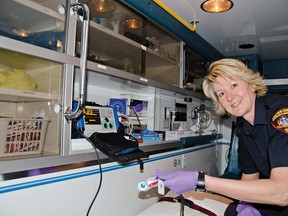 Jennifer Fisher-Sundberg, an EMT captain with PCES, shows off a defibrillator in an ambulance. The 15-year veteran of the service was recognized with the exemplary service award last June.
John Stoesser photos/QMI Agency.