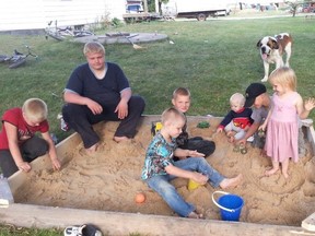 Seven of the Froese children play in a sandbox in this family Facebook photo. Four of the family's boys died in a house fire in Kane, Man. Feb. 25, 2015.
