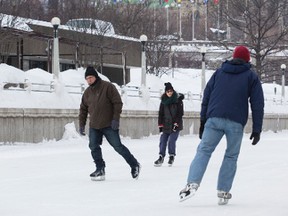 Skaters enjoy the Rideau Canal Skateway in Ottawa backdropped by the Parliament Buildings. February 25, 2015. Errol McGihon/Ottawa Sun/QMI Agency