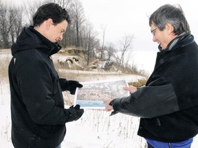 Peter Dutchak, left, deputy director of engineering services for Elgin county, and Clayton Watters, director, point out on a topographical map a severe section of erosion bordering Elgin County Road 24 (Dexter Line), two km west of Port Bruce in this 2011 picture.
File photo