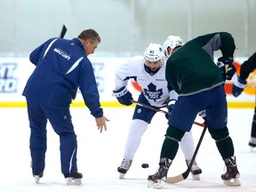 Maple Leafs coach forwards Nazem Kadri (left) and Peter Holland work on their faceoff skills on Feb. 25, 2015. (MICHAEL PEAKE/Toronto Sun)