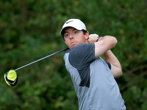Main: Rory McIlroy of Northern Ireland takes a shot during Wednesday’s pro-am in Palm Beach Gardens. (AFP)