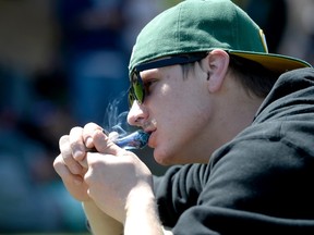 A man smokes marijuana from a pipe.
REUTERS/Mark Leffingwell