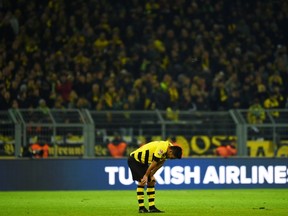 Dortmund's midfielder Ilkay Guendogan reacts after the German first division Bundesliga football match Borussia Dortmund vs FC Augsburg in the Signal Iduna Park stadium in Dortmund, western Germany on February 4, 2015. Augsburg won 0-1. AFP PHOTO / PATRIK STOLLARZ