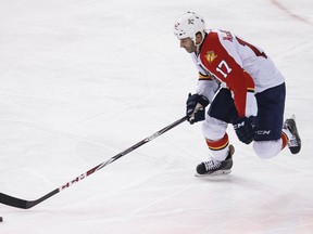 Florida centre Derek MacKenzie (17) is seen with the puck during the third period of a NHL hockey game between the Edmonton Oilers and the Florida Panthers at Rexall Place in Edmonton, Alta., on Sunday, Jan. 11, 2015. Ian Kucerak/Edmonton Sun/ QMI Agency