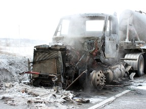 A transport truck carrying dry concrete caught fire outside of Kingston, Ont. on Thursday February 26, 2015. Steph Crosier/Kingston Whig-Standard/QMI Agency