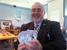 Audit Committee Chairman Allan Hubley poses with cards he ordered for each member of the new city panel. 
(JON WILLING Ottawa Sun file)