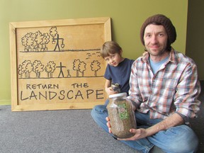 Shawn McKnight, with his son Indie McKnight, 5, hold jars of seeds in new space McKnight is opening up on Christina Street in April that will be space for several organizations, including Return the Landscape, Artwalk and One Tomato. THE OBSERVER/ QMI AGENCY
