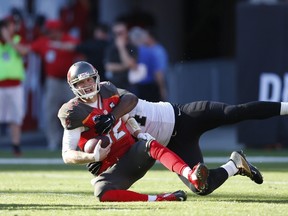 Cameron Jordan of the New Orleans Saints sacks Josh McCown of the Tampa Bay Buccaneers at Raymond James Stadium on December 28, 2014 in Tampa, Florida. (Joe Robbins/Getty Images/AFP)