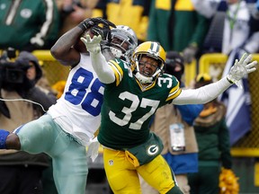Dallas Cowboys wide receiver Dez Bryant (88) tries to make a catch against Green Bay Packers cornerback Sam Shields (37) during the 2014 NFC Divisional playoff game at Lambeau Field. Mandatory (Jeff Hanisch/USA TODAY Sports)