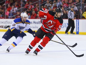 New Jersey Devils winger Jaromir Jagr (68) skates with the puck as St. Louis Blues centre David Backes chases during NHL play at the Prudential Center. (Ed Mulholland/USA TODAY Sports)