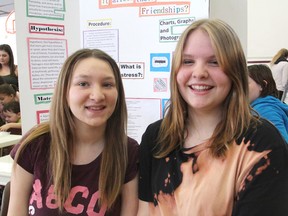 Negan Major-Thompson, left, and Makayla Van Riel, students at Frontenac Public School, did a multi-school survey on stress and friendship for their school's science fair, finding the more friends a teenager has, the less stress they feel. (Michael Lea/The Whig-Standard)