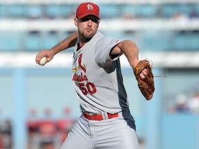 St. Louis Cardinals pitcher Adam Wainwright (50) throws to the Los Angeles Dodgers in Game 1 of the 2014 NLDS at Dodger Stadium. (Jayne Kamin-Oncea/USA TODAY Sports)