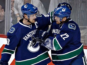 Henrik Sedin (left) and his twin brother Daniel Sedin of the Vancouver Canucks, who have owned harness racing horses which competed in Europe, have purchased two colts on this side of the Atlantic, which will be aimed at North American events. (ANDY CLARK/Reuters files)