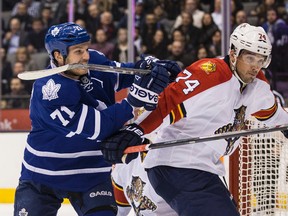 David Clarkson of the Toronto Maple Leafs  battles Shane O'Brien of Florida Panthers during NHL action at the Air Canada Centre  on Tuesday February 17, 2015. (Craig Robertson/Toronto Sun/QMI Agency)