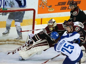 Peterborough Petes goaltender Matthew Mancina makes a save on Sudbury Wolves forward Chad Heffernan during OHL action in Peterborough on Thursday night.
