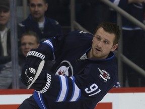 Jiri Tlusty fires a shot on net during the pre-game warmup Thursday night.