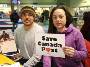 Richard Pepin and Amanda Kingsbury, of the Canadian Union of Postal Workers, Local 612, were in the Rainbow Centre in Sudbury, Ont. holding an information session for the public on the impact of Canada Post's service cuts on Thursday February 26, 2015. John Lappa/Sudbury Star/QMI Agency