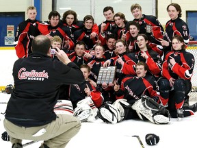 Head coach Ian Avery takes a team photo of the Lambton-Kent Cardinals after their 2-1 win over the Lambton Central Lancers in the LKSSAA 'A-AA' boys hockey final Thursday in Dresden. (MARK MALONE/The Daily News)