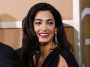 Amal Clooney arrives at the 72nd Golden Globe Awards in Beverly Hills, California January 11, 2015.  REUTERS/Mario Anzuoni