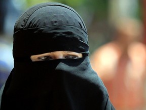 A woman wearing a niqab. 

REUTER/Mohamed Abd El Ghany