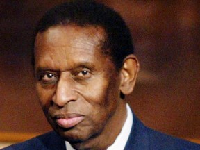 Earl Lloyd, the first African-American player to ever play in the NBA in 1950, is seen as he is officially inducted into the Basketball Hall of Fame in the Hall's "Honors Ring" in Springfield, Massachusetts in this September 5, 2003 file photo. Lloyd died on February 26, 2015 at the age of 86, the league said on its website. The cause of death was not disclosed. (REUTERS/Jim Bourg/Files)