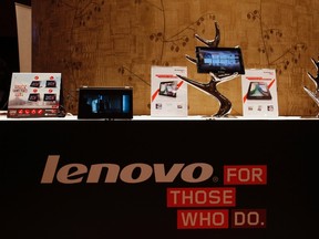 Lenovo tablets and mobile phones are displayed during a news conference on the company's annual results in Hong Kong in this May 23, 2013 file photo. REUTERS/Bobby Yip/Files