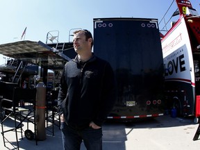 Travis Kvapil stands in the garage area during practice for the NASCAR Sprint Cup Series Folds of Honor QuikTrip 500 at Atlanta Motor Speedway on February 27, 2015 in Hampton, Georgia. (Kevin C. Cox/Getty Images/AFP)