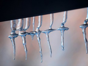 Icicles hang from a house in the city during recent stretch of cold weather. The cold has played havoc with pipes. The City reported 128 properties had reported frozen pipes. Tony Caldwell/Ottawa Sun/QMI Agency