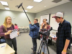 North Lambton Secondary School students, from left, Julia Soetemans, Geoffrey Hawkins, Kloe Nardi and Dave Bos try out filmmaking equipment during a workshop Friday in Sarnia led by staff from the Toronto International Film Festival. It was organized by the Optimist and Kiwanis clubs in Forest, as part of their upcoming Lambton Youth Short Film Competition.  THE OBSERVER/ QMI AGENCY